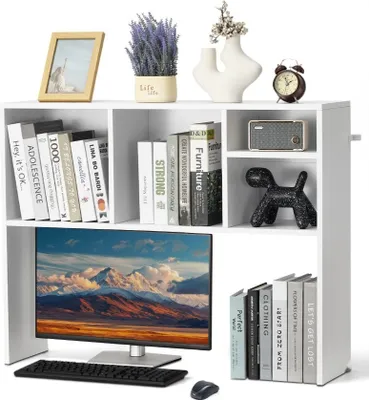 A white desk organizer shelf unit with books, a computer monitor, keyboard, mouse, and decorative items.