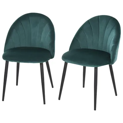 Two green velvet chairs with black legs are shown against a white background.