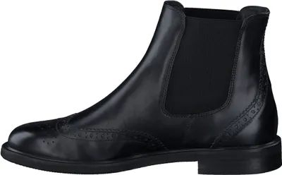 A side view of a black leather Chelsea boot with brogue detailing.