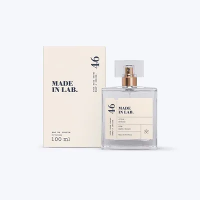 A bottle of perfume and its box are displayed on a light gray background.
