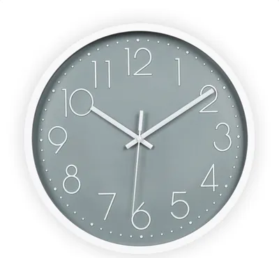 A minimalist wall clock with a gray face and white numbers and hands, set against a white background.