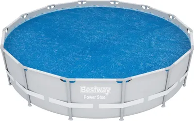 An above-ground swimming pool with a blue solar cover.