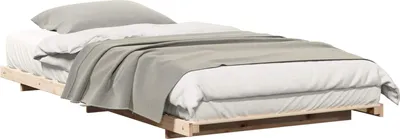 A bed frame with bedding on a white background.