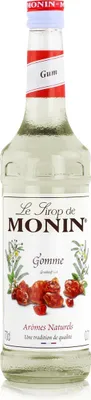 A clear, well-lit studio shot of a bottle of Monin Gum syrup.