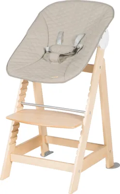 A baby high chair with a padded seat and safety harness, made of wood.