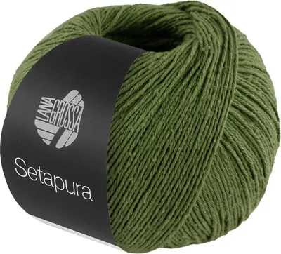 A ball of green yarn with a black label.