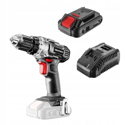 A cordless drill with two batteries and a charger, displayed against a white background.