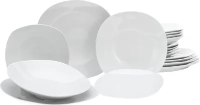 A collection of white ceramic plates and bowls arranged on a white background.