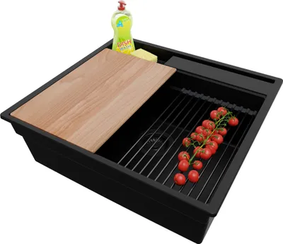 A black kitchen sink with a wooden cutting board, a dish soap bottle, a sponge, and a bunch of cherry tomatoes on a drying rack.