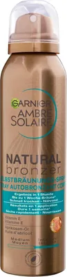 A spray bottle of Garnier Ambre Solaire Natural Bronzer.