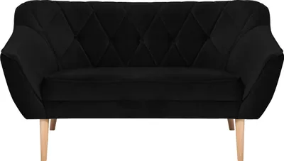 A black velvet sofa with diamond tufting on the backrest and seat, supported by light-colored wooden legs.