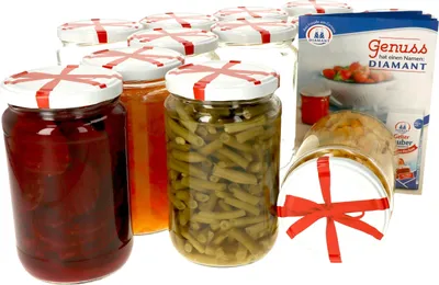 A collection of glass jars filled with preserved food items, along with a product information leaflet.