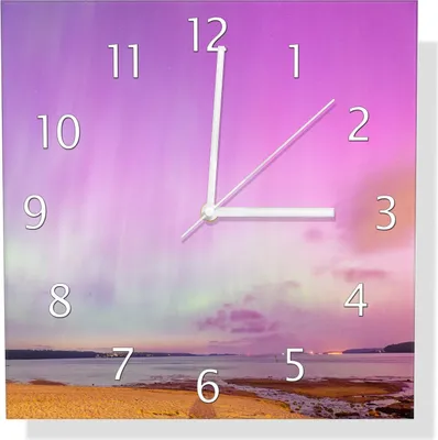 Produktbild von Wallario Design Wanduhr Leuchtende Lichter über Sandstrand aus Echtglas, Größe 30 x 30 cm