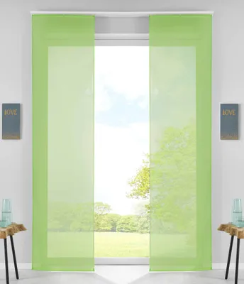 Two green panel curtains are shown hanging in front of a window with a view of trees and a lawn.