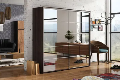 A modern bedroom or dressing room with a large mirrored wardrobe, a chair, and a coat rack.