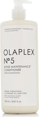 A white pump bottle of Olaplex No. 5 Bond Maintenance Conditioner.