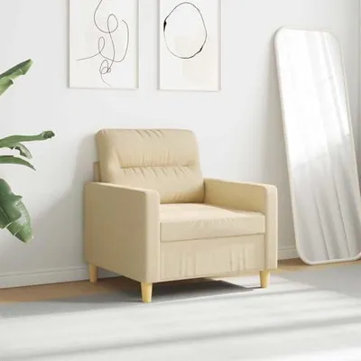 Imagen del producto de Sillón tapizado en color crema, con estructura de metal, de 60 cm de ancho, con un diseño compacto y elegante, ideal para el salón