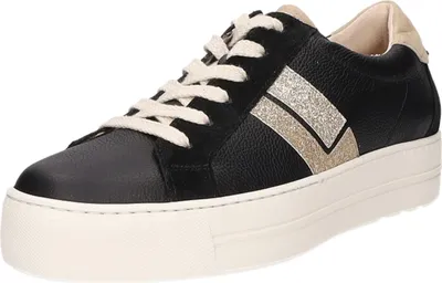 A studio shot of a black sneaker with gold accents and a white platform sole.