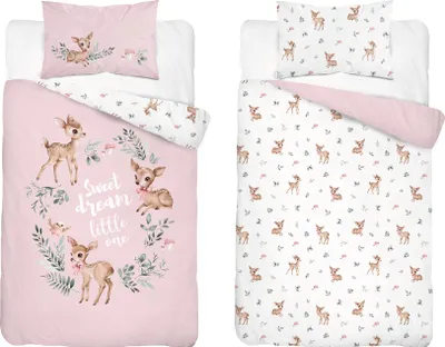 Two baby bedding sets are displayed side-by-side on a white background. The left set features a pink duvet cover with a wreath of deer and foliage, and the text 'Sweet dream little one'. The right set has a white duvet cover with a repeating pattern of sma