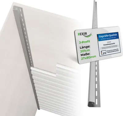 A close-up view of a gray J-profile siding trim piece attached to a white wall, with a white siding panel partially visible below it. A white informational tag is attached to the trim piece.