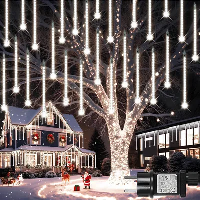 A festive Christmas scene with a decorated house and a tree adorned with icicle lights.