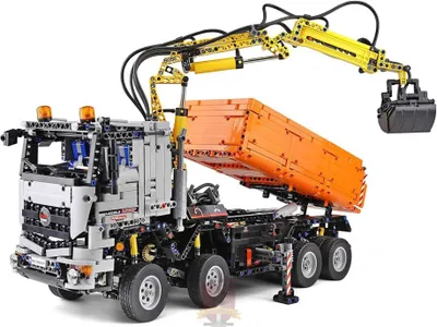 A Lego Technic model of a remote-controlled truck with a crane and dump bed.