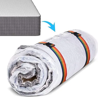 A mattress is shown partially rolled up and vacuum-sealed in plastic, with rainbow-colored straps holding it together. An arrow indicates the process of rolling up the mattress.