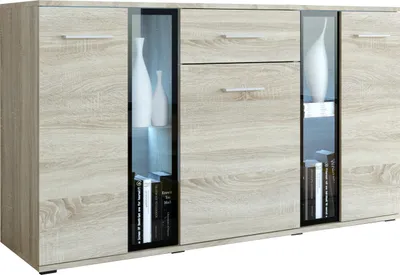 A light wood sideboard with glass doors and drawers, displaying decorative vases and books.