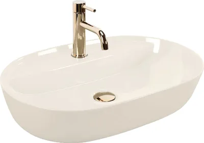 A white oval countertop sink with a chrome faucet.
