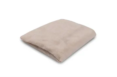 A folded beige fabric item, possibly a cover or blanket, is shown against a white background.