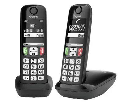 Two black Gigaset cordless phones are shown against a white background. One phone is in its charging base.