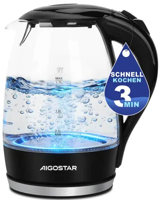 A glass electric kettle with water boiling and blue LED lights at the base.