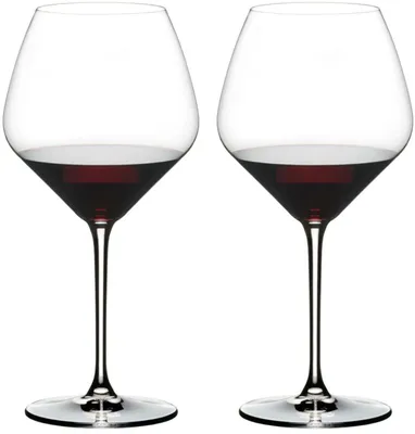 Two wine glasses filled with red wine, presented against a white background.