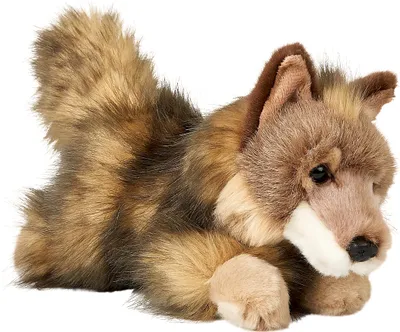 A plush toy wolf cub lying down.
