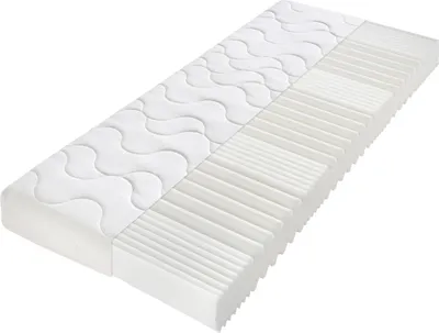A white mattress is shown from a diagonal angle against a white background.