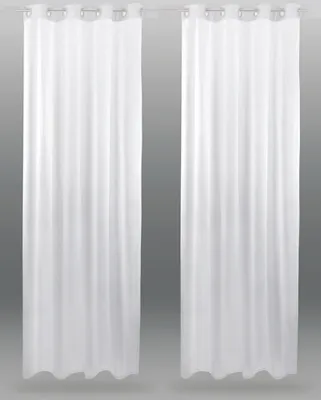 Two white sheer curtains hanging on a rod against a gray background.