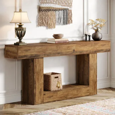 A rustic wooden console table with decorative items and a woven wall hanging.