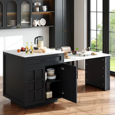 A modern kitchen with a black kitchen island and an extendable table.