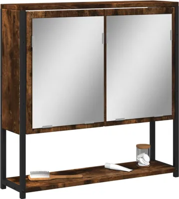A bathroom cabinet with two mirrored doors and a shelf below, displaying a toothbrush and a jar of cotton pads.