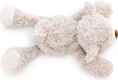A plush toy bear lying on its side against a white background.