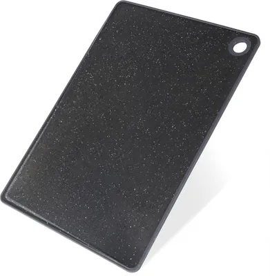 A black cutting board with a granite-like texture and a hole for hanging, shown on a white background.