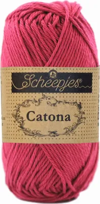 A ball of pink yarn with a label.