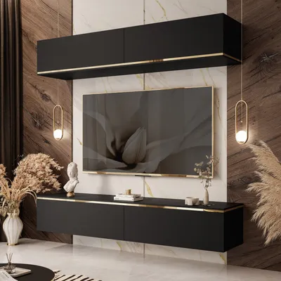 A modern living room with a wall-mounted entertainment unit, TV, and decorative items.