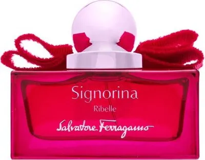 A perfume bottle with a red liquid and a red ribbon bow.