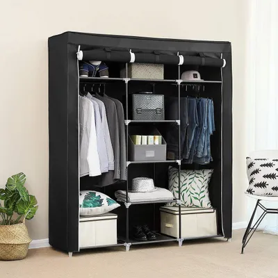 A black fabric wardrobe with shelves and hanging space, neatly organized with clothes and storage boxes.