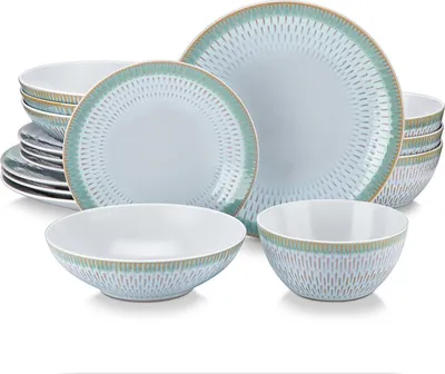 A set of stoneware dishes with a blue and green patterned rim, including plates and bowls.