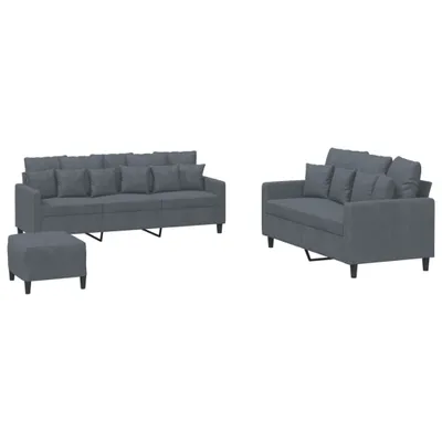 A grey fabric sofa set with accent pillows and a matching ottoman on a white background.