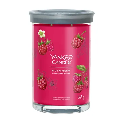 A Yankee Candle Red Raspberry scented candle in a glass jar with a gray lid.