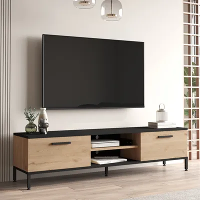 A modern TV stand with a television mounted above it, in a well-lit room.