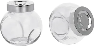 Two clear glass jars with silver lids are shown against a white background.